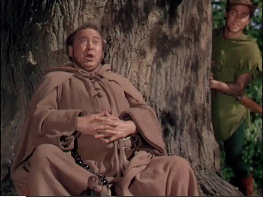 Friar Tuck sings as Robin prepares to join in