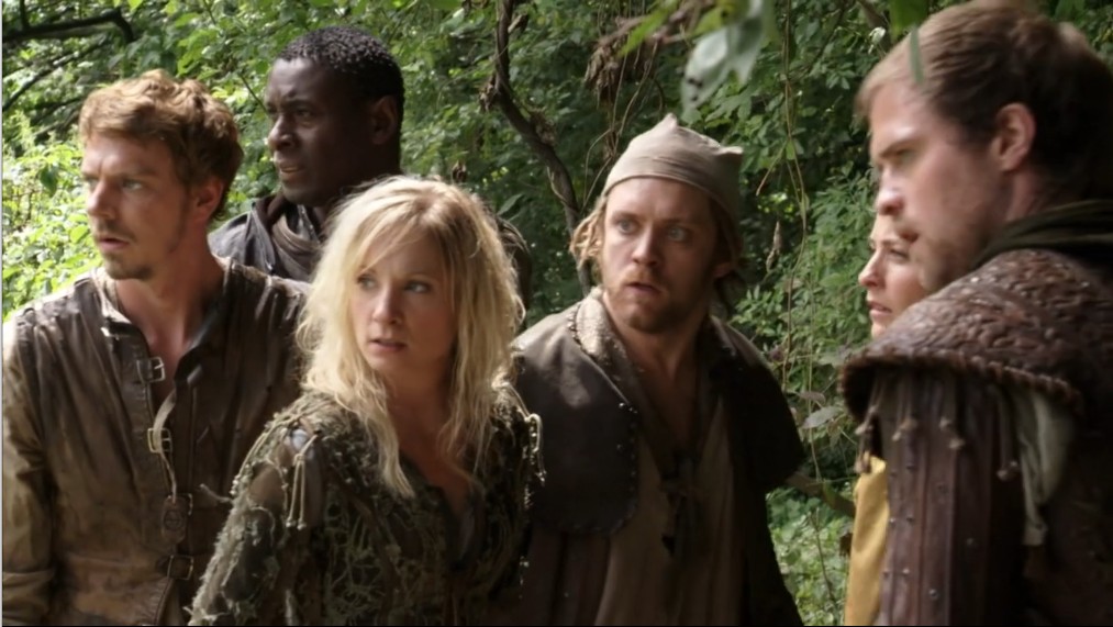 Kate of Locksley flanked by Allan and Much, with Robin and Isabella in frame