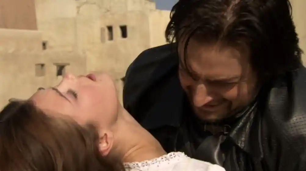Guy as he stabs Marian