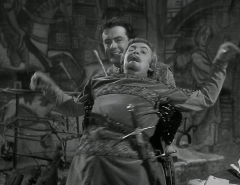 Richard Greene's Robin uses Leo McKern's Sir Roger as a human shield