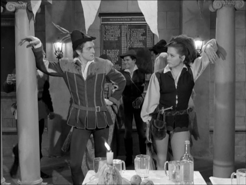 The two Robin Hoods - Duboys and Mrs. Peel -- size each other up