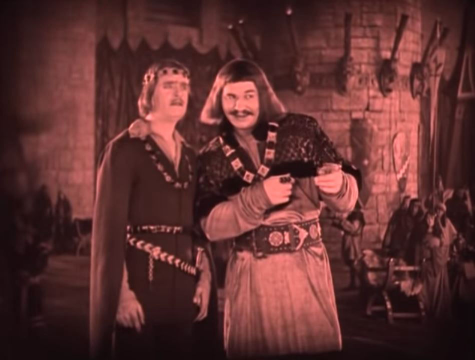King Richard points out the women to Douglas Fairbanks's Robin Hood