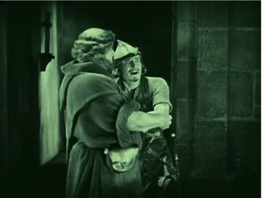 Willard Louis's Friar Tuck comforts Douglas Fairbanks's Robin Hood