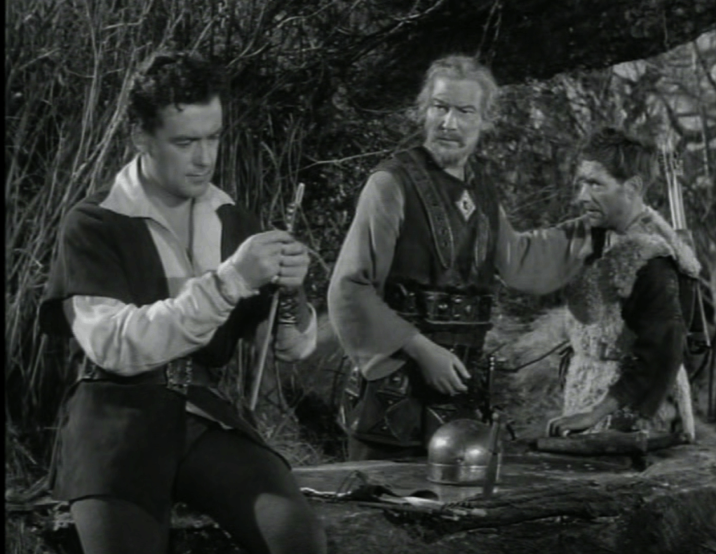 Robin calmly examining arrow as he tells Will they gave half the money back