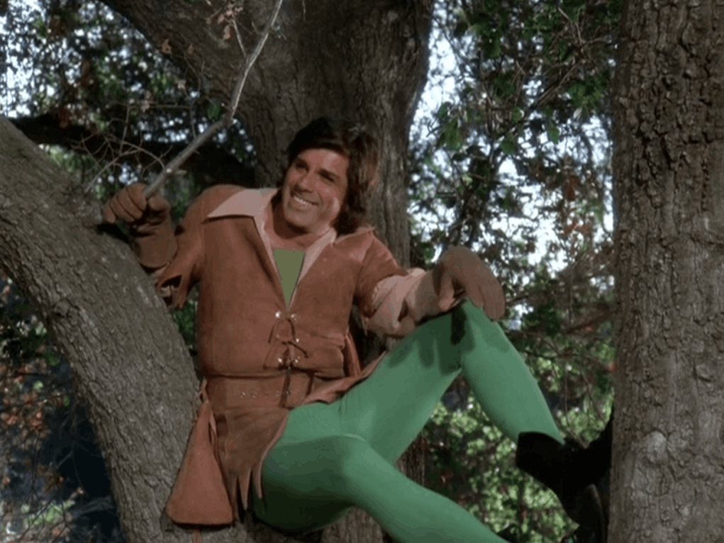 Dick Gautier as Robin Hood hanging out in a tree