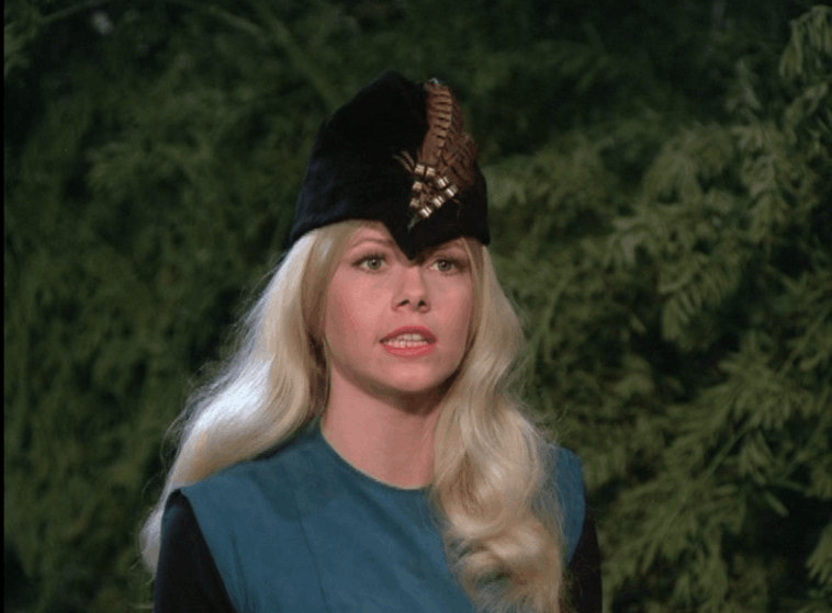 Marian in outlaw garb